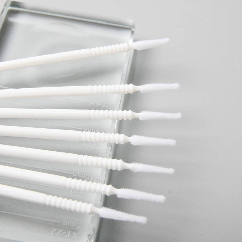 Five white cotton swab brushes for eyelash extensions show details